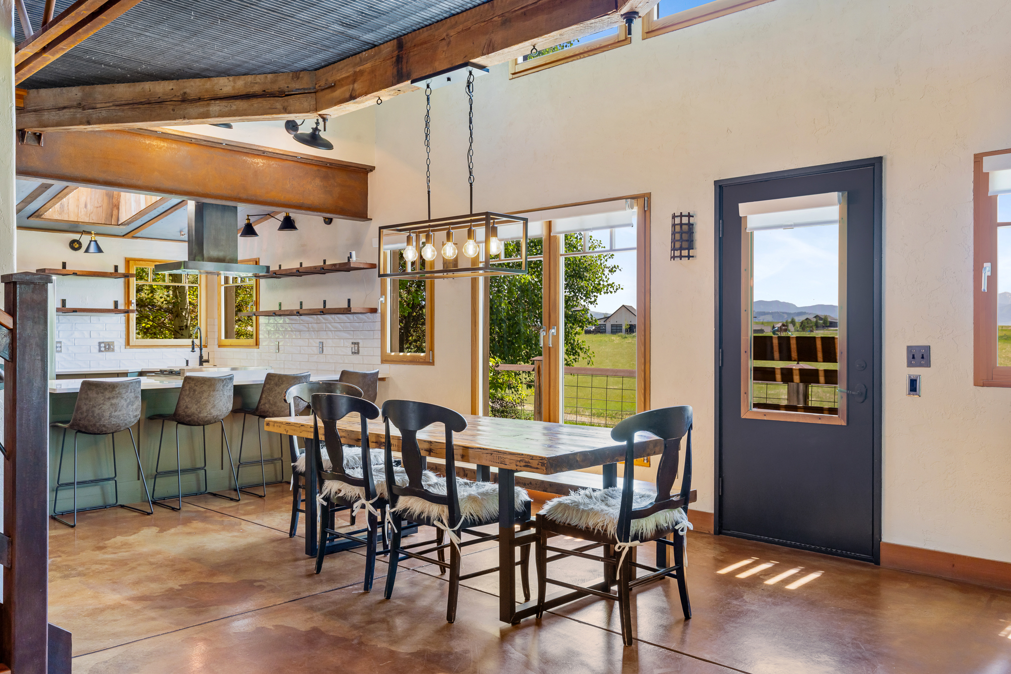 Custom timber frame home at 2449 Turkey Red Lane in Bozeman’s Wheatland Hills with clay walls and wooded privacy
